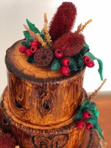 timber themed wedding cake with hand made banksia native flowers