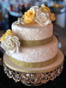 two tier wedding cake with hand made sugar flowers