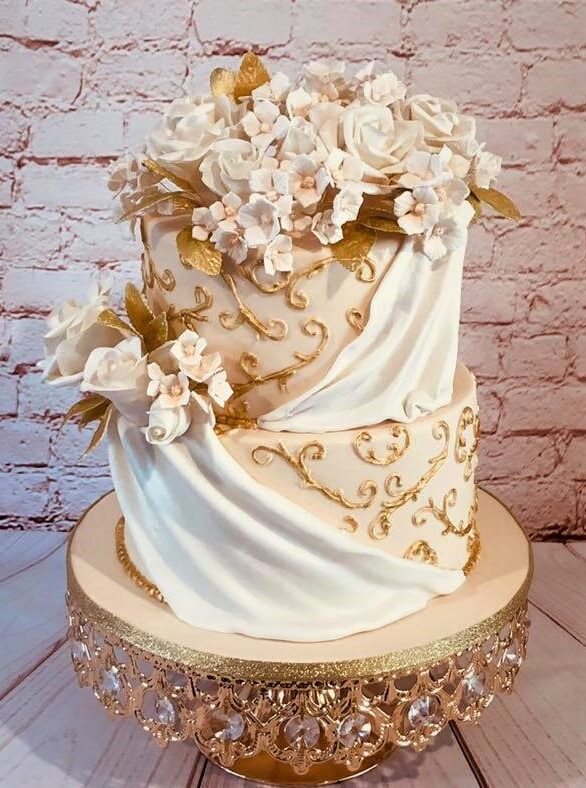 2 tier wedding cake on display stand