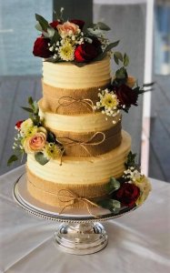 3 tier buttercream wedding cake with red and pink roses by rimma's wedding cakes perth