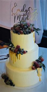3 tier buttercream wedding cake with white chocolate dripping and fresh fruits by rimma's wedding cakes perth