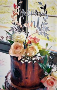 3 tier log themed wedding cake with fresh flowers and custom cake topper by rimma's wedding cakes perth