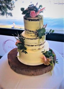 3 tier semi naked wedding cake with fresh flowers by rimma's wedding cakes perth