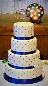 4 tier white wedding cake with purple ribbon and edible diamonds by rimma's wedding cakes perth